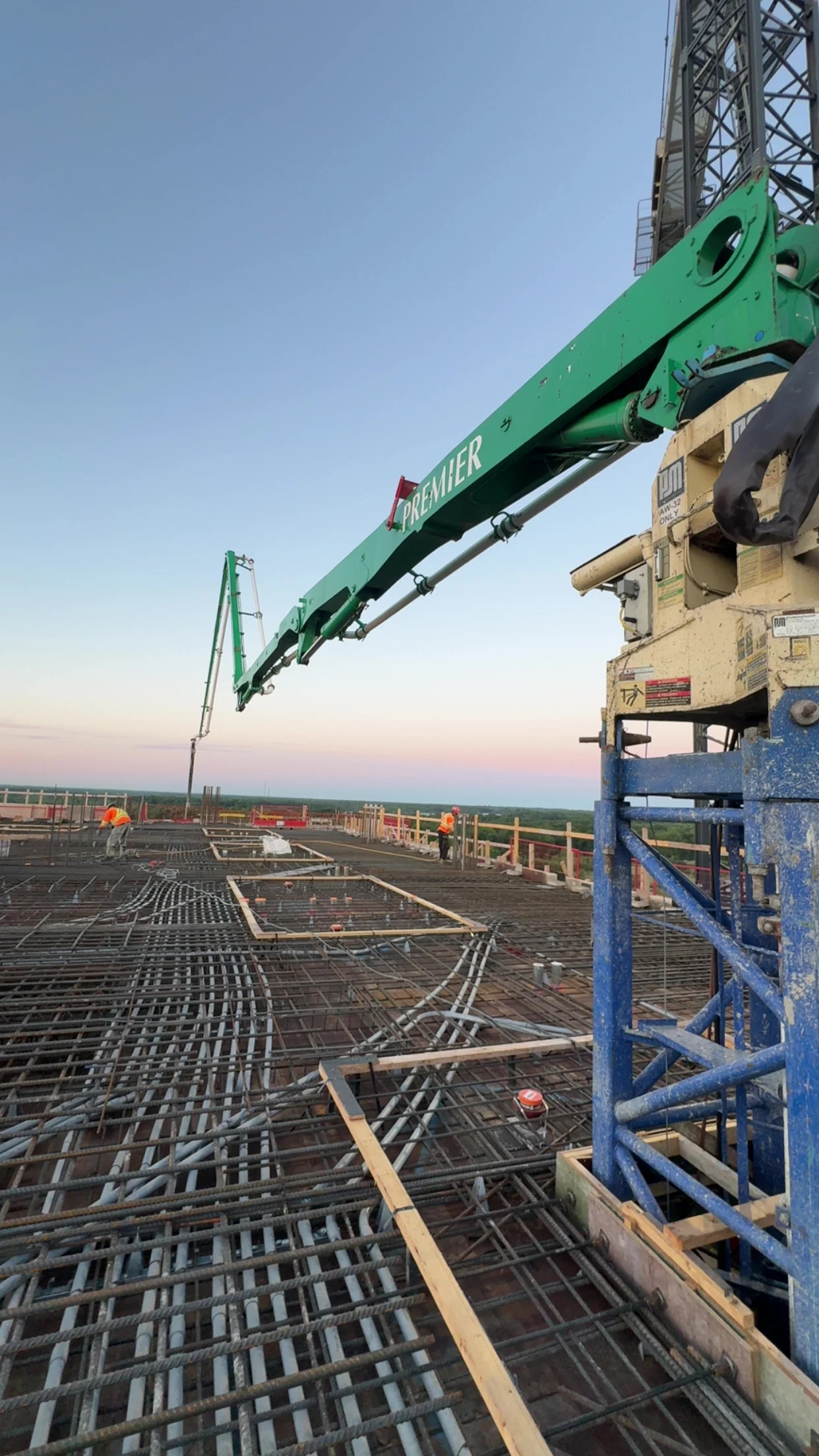Premier Concrete Pumping placing boom large floor pour, marketing by Groundowrk Agency