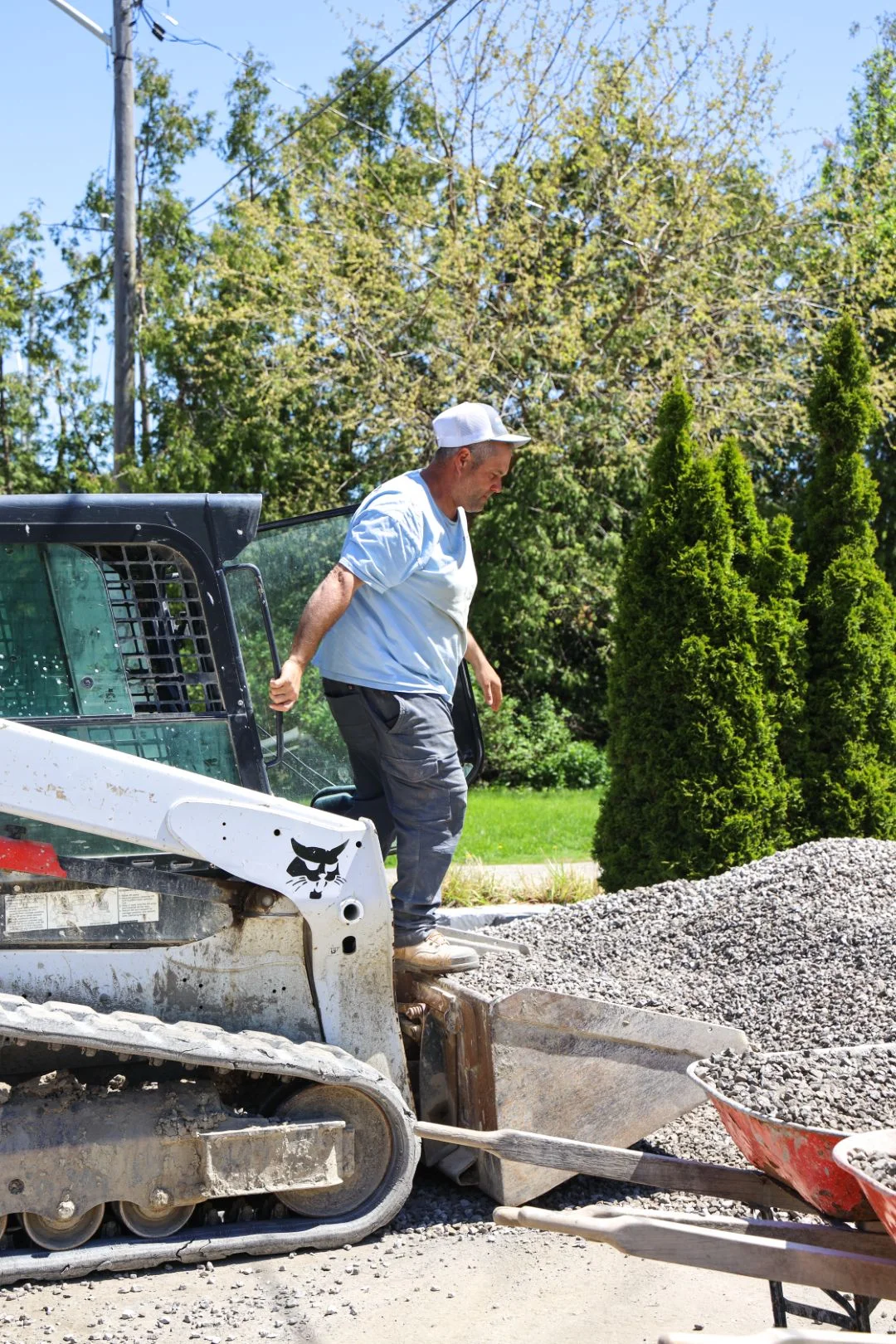Destination Pools crew completing landscaping and pool construction at residential backyard