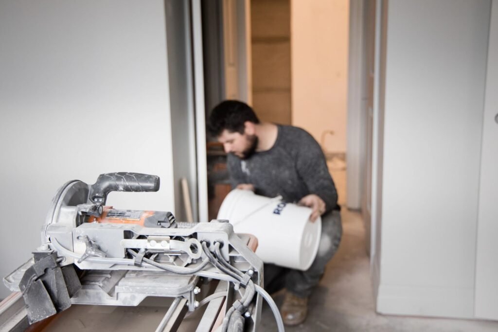 Residential renovation contractor working on interior painting and finishing project at residential property