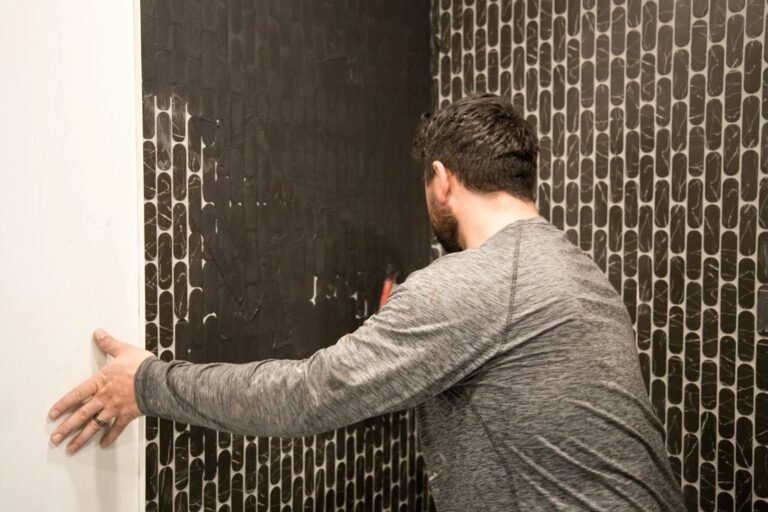 Residential renovation contractor working on interior painting and finishing project at residential property